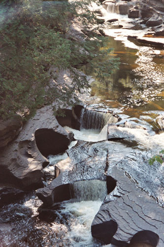 circles carved into the bed of the river at Presque Isle